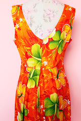 Women's vintage 1970's ears Hawaiian Fashions label sleeveless cotton material ankle length orange dress with all Hawaiian floral print.