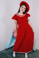 Women's vintage 1970's short sleeve flutter sleeve red velvet ankle length dress with white applique trim.
