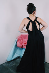 Women's vintage 1980's long ankle length sleeveless black polyester dress with a strappy cut out back