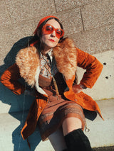 Women's vintage 1970's Leatherscapade, Made in Argentina label long sleeve brown orange genuine leather suede coat with faux fur trim and shearling liner with matching tie belt.