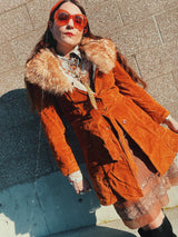 Women's vintage 1970's Leatherscapade, Made in Argentina label long sleeve brown orange genuine leather suede coat with faux fur trim and shearling liner with matching tie belt.