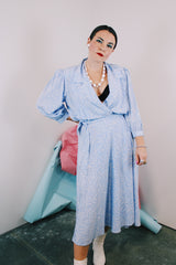 Women's vintage 1980's Argenti Pure label 3/4 arm length baby blue midi length wrap dress with all over white print and a double lapel