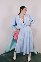 Women's vintage 1980's Argenti Pure label 3/4 arm length baby blue midi length wrap dress with all over white print and a double lapel