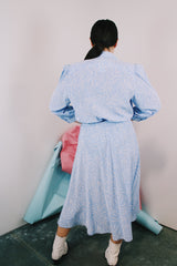 Women's vintage 1980's Argenti Pure label 3/4 arm length baby blue midi length wrap dress with all over white print and a double lapel