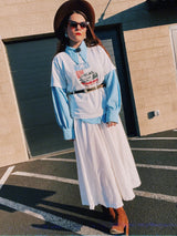 Men's or women's vintage 1970's long sleeve light blue polyester button up shirt with very pointy dagger collar and puff sleeves.