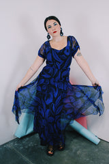 Women's vintage 1940's capped sleeve ankle length dress in black with all over cobalt blue print
