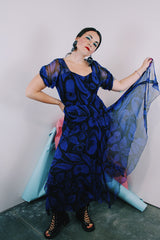 Women's vintage 1940's capped sleeve ankle length dress in black with all over cobalt blue print
