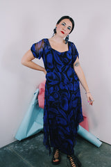 Women's vintage 1940's capped sleeve ankle length dress in black with all over cobalt blue print