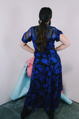 Women's vintage 1940's capped sleeve ankle length dress in black with all over cobalt blue print