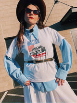 Men's or women's vintage 1970's long sleeve light blue polyester button up shirt with very pointy dagger collar and puff sleeves.