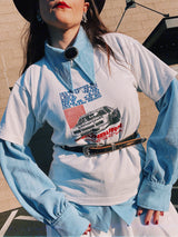 Men's or women's vintage 1970's long sleeve light blue polyester button up shirt with very pointy dagger collar and puff sleeves.