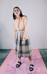 long sleeve peach colored blouse with ruffle front and ruffle neck vintage 1980's