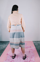 long sleeve peach colored blouse with ruffle front and ruffle neck vintage 1980's