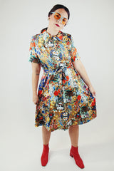 all over floral print short sleeve knee length dress with front half zipper and matching tie belt vintage 1970's