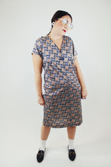 black and brown abstract print short sleeve mid length zip up dress vintage 1960's