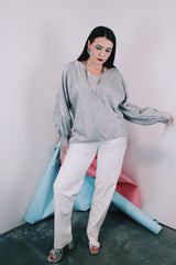 Women's vintage 1970's Saks Alley label long sleeve silver metallic blouse with fringe trim on cuffs and hem