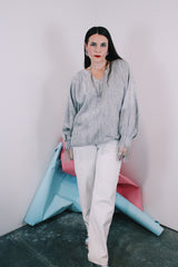 Women's vintage 1970's Saks Alley label long sleeve silver metallic blouse with fringe trim on cuffs and hem