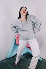 Women's vintage 1970's Saks Alley label long sleeve silver metallic blouse with fringe trim on cuffs and hem