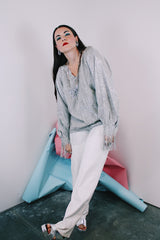 Women's vintage 1970's Saks Alley label long sleeve silver metallic blouse with fringe trim on cuffs and hem