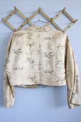 Women's vintage 1960's Dynasty Trade Mark label long sleeve cropped satin silk like robe jacket with all over print and fabric closures.