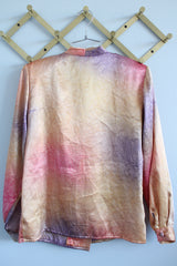 Women's vintage 1980's Impressions of California, Made in USA label long sleeve slinky silk like blouse with double breasted closure in orange, purple, and pink.