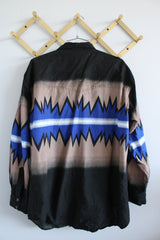 Men's vintage 1980's Express Rider label long sleeve button up shirt with a black, blue, and beige Western style print.