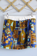 Women's vintage 1970's Go Barefoot Paradise, Honolulu, Hawaii label mini length wrap skirt in white towel material with cotton Hawaiian print fabric on top
