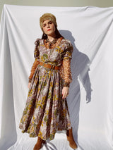 purple and green floral printed midi length dress with short sleeve puff sleeves buttons up the front vintage 1980's