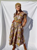 purple and green floral printed midi length dress with short sleeve puff sleeves buttons up the front vintage 1980's