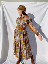 purple and green floral printed midi length dress with short sleeve puff sleeves buttons up the front vintage 1980's