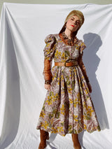 purple and green floral printed midi length dress with short sleeve puff sleeves buttons up the front vintage 1980's