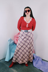 Women's vintage 1970's ankle length maxi skirt in acrylic material. White with red, navy, and silver metallic plaid print all over