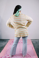 long sleeve button up shirt in pastel green and orange stripes