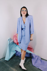 Women's vintage 1980's matching periwinkle purple dress and jacket set. Jacket is open with 3/4 arm length. Dress has cinched waist, short sleeves, and a double lapel neckline