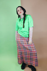 Women's vintage 1970's ankle length maxi skirt in an acrylic material with plaid print and a-line shape.