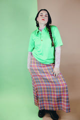 Women's vintage 1970's ankle length maxi skirt in an acrylic material with plaid print and a-line shape.