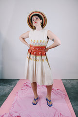 sleeveless knee length dress in tan with floral print in the middle linen vintage 1960's