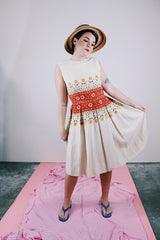 sleeveless knee length dress in tan with floral print in the middle linen vintage 1960's