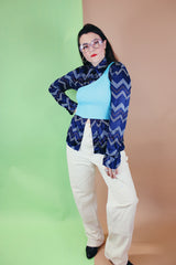 Women's or men's vintage 1970's Roland label long sleeve button up shirt with a pointy collar in navy slinky polyester with a zig zag print.