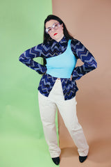 Women's or men's vintage 1970's Roland label long sleeve button up shirt with a pointy collar in navy slinky polyester with a zig zag print.