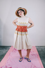 sleeveless knee length dress in tan with floral print in the middle linen vintage 1960's