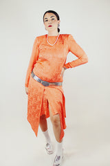 long sleeve orange silk dress with polka dot print and asymmetrical hem vintage 1980's