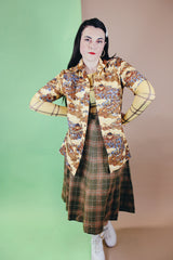 Women's or men's vintage 1970's short sleeve button up shirt with a pointy collar, brown buttons, and all over print in lightweight, soft polyester material