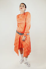 long sleeve orange silk dress with polka dot print and asymmetrical hem vintage 1980's