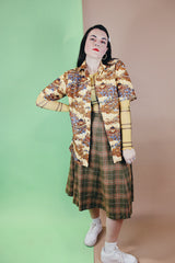 Women's or men's vintage 1970's short sleeve button up shirt with a pointy collar, brown buttons, and all over print in lightweight, soft polyester material