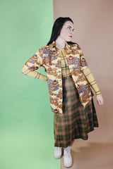 Women's or men's vintage 1970's short sleeve button up shirt with a pointy collar, brown buttons, and all over print in lightweight, soft polyester material