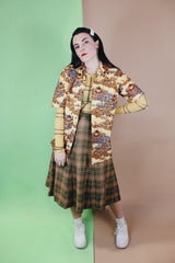 Women's or men's vintage 1970's short sleeve button up shirt with a pointy collar, brown buttons, and all over print in lightweight, soft polyester material