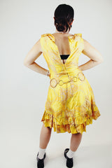 sleeveless knee length floral print yellow dress with ruffle trim vintage 1960s