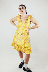 sleeveless knee length floral print yellow dress with ruffle trim vintage 1960s