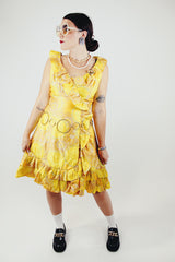 sleeveless knee length floral print yellow dress with ruffle trim vintage 1960s